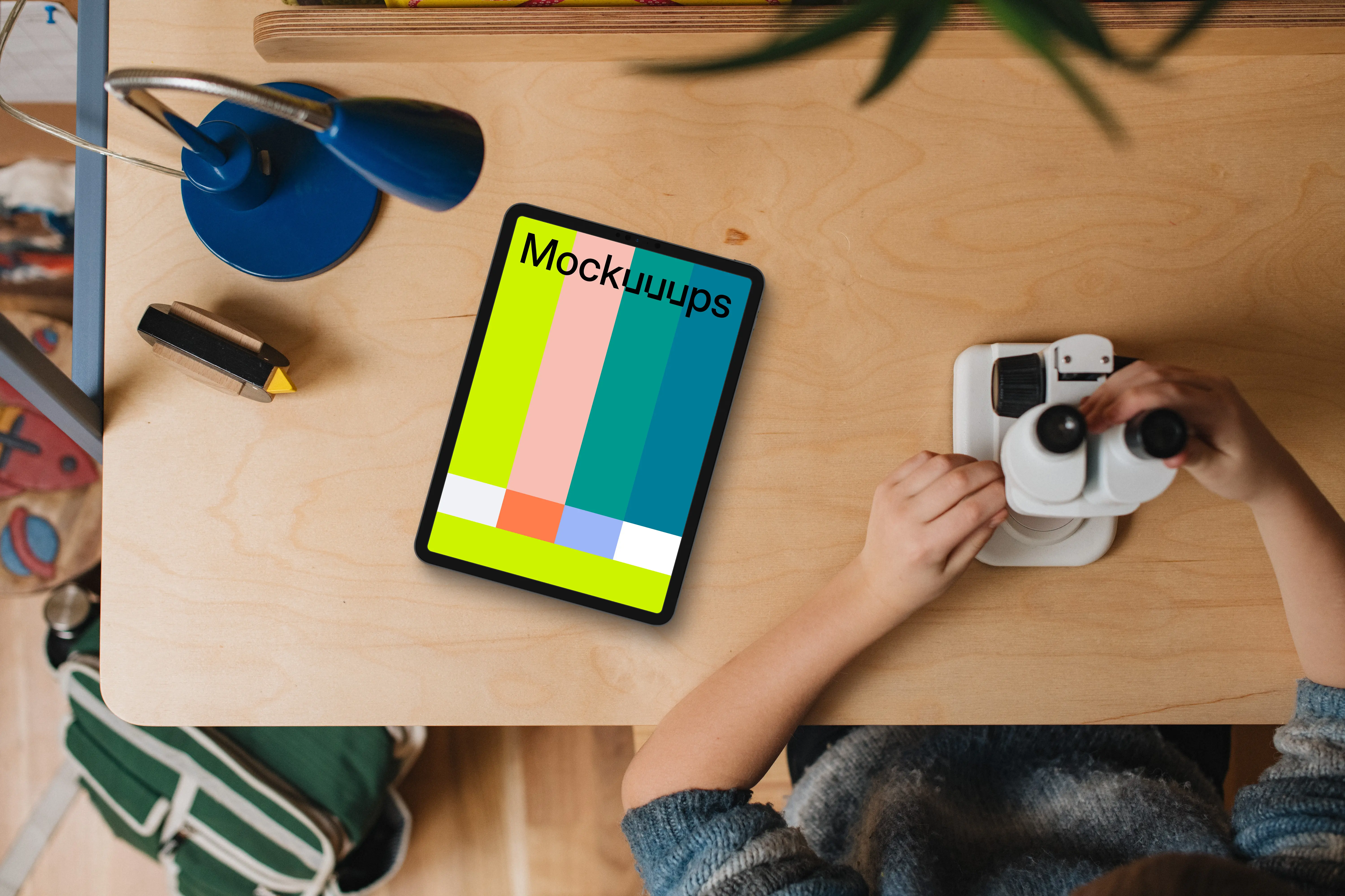 Tablet mockup on child's creative workspace