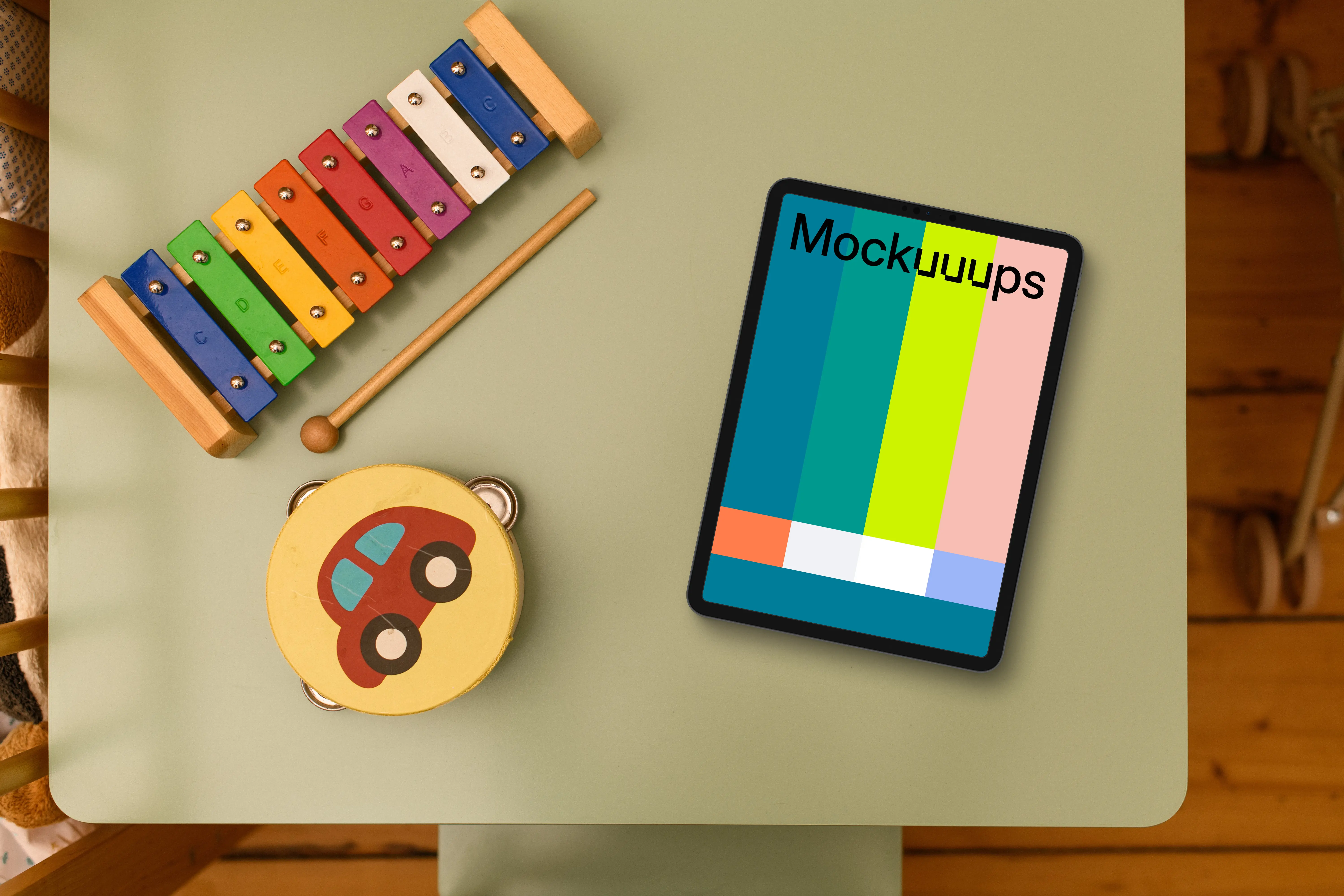 Tablet mockup on kid's study table with educational toys