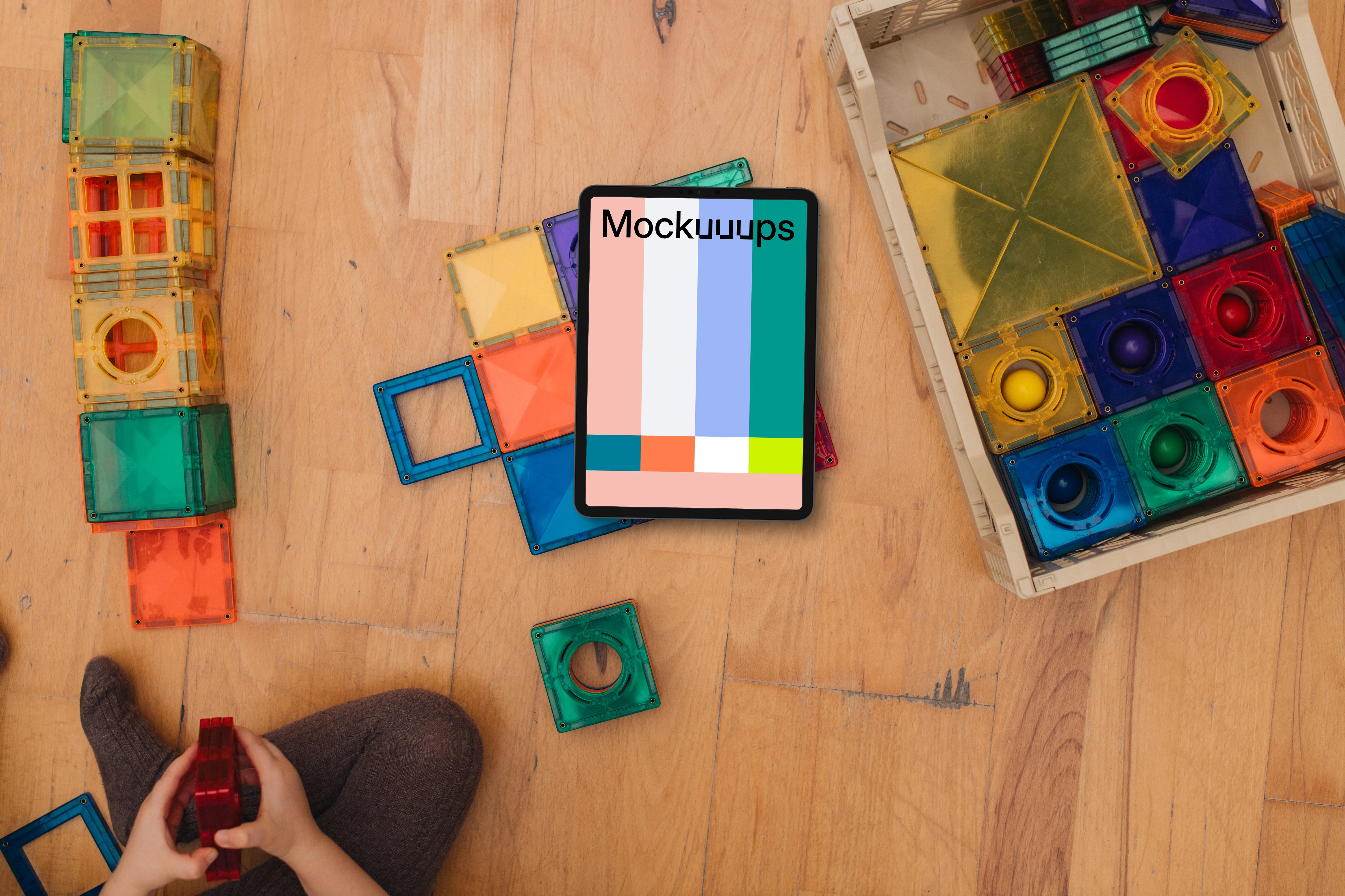 Tablet mockup surrounded by colorful building blocks