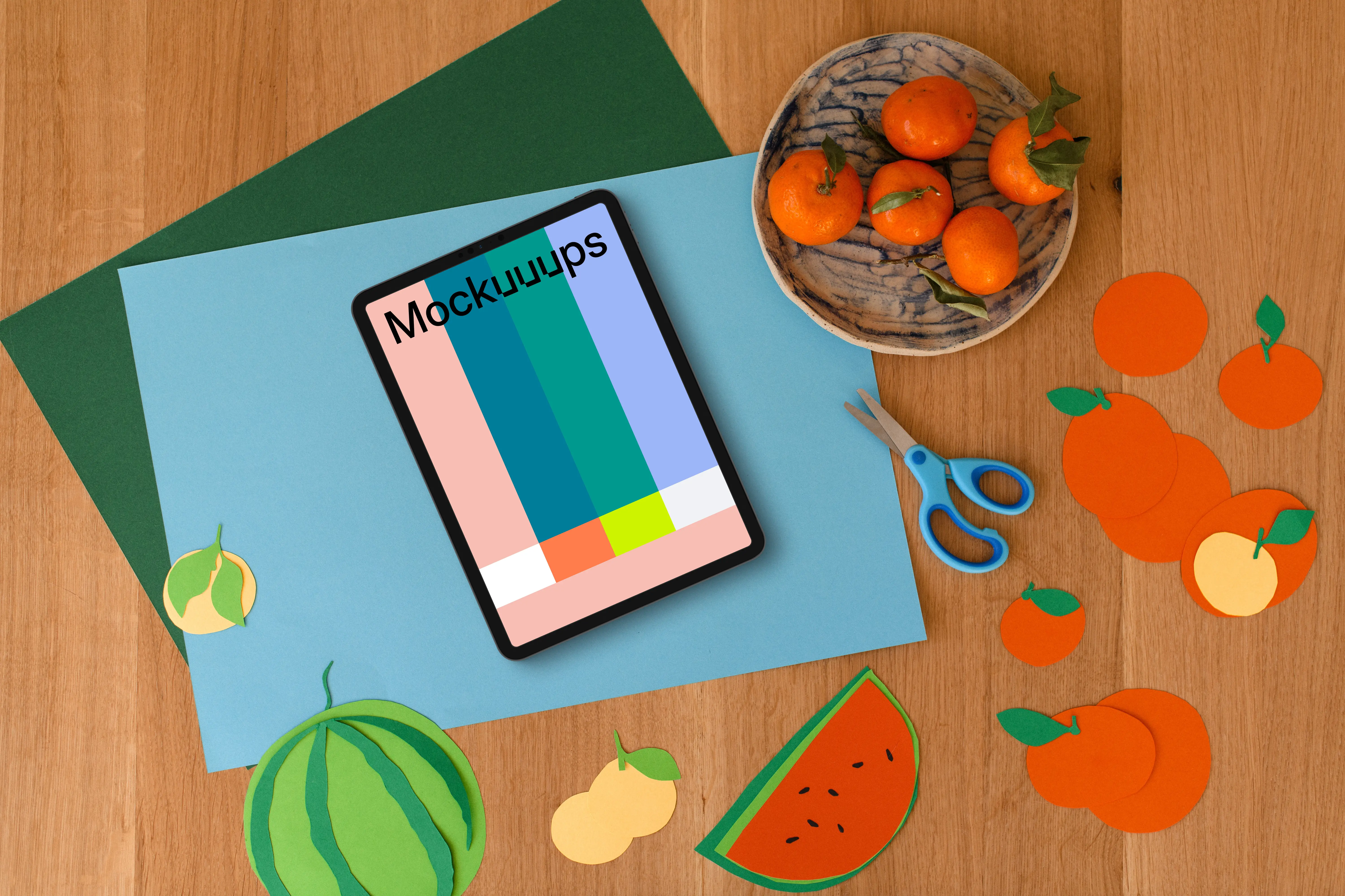 Tablet mockup with colorful fruit paper cutouts for kids