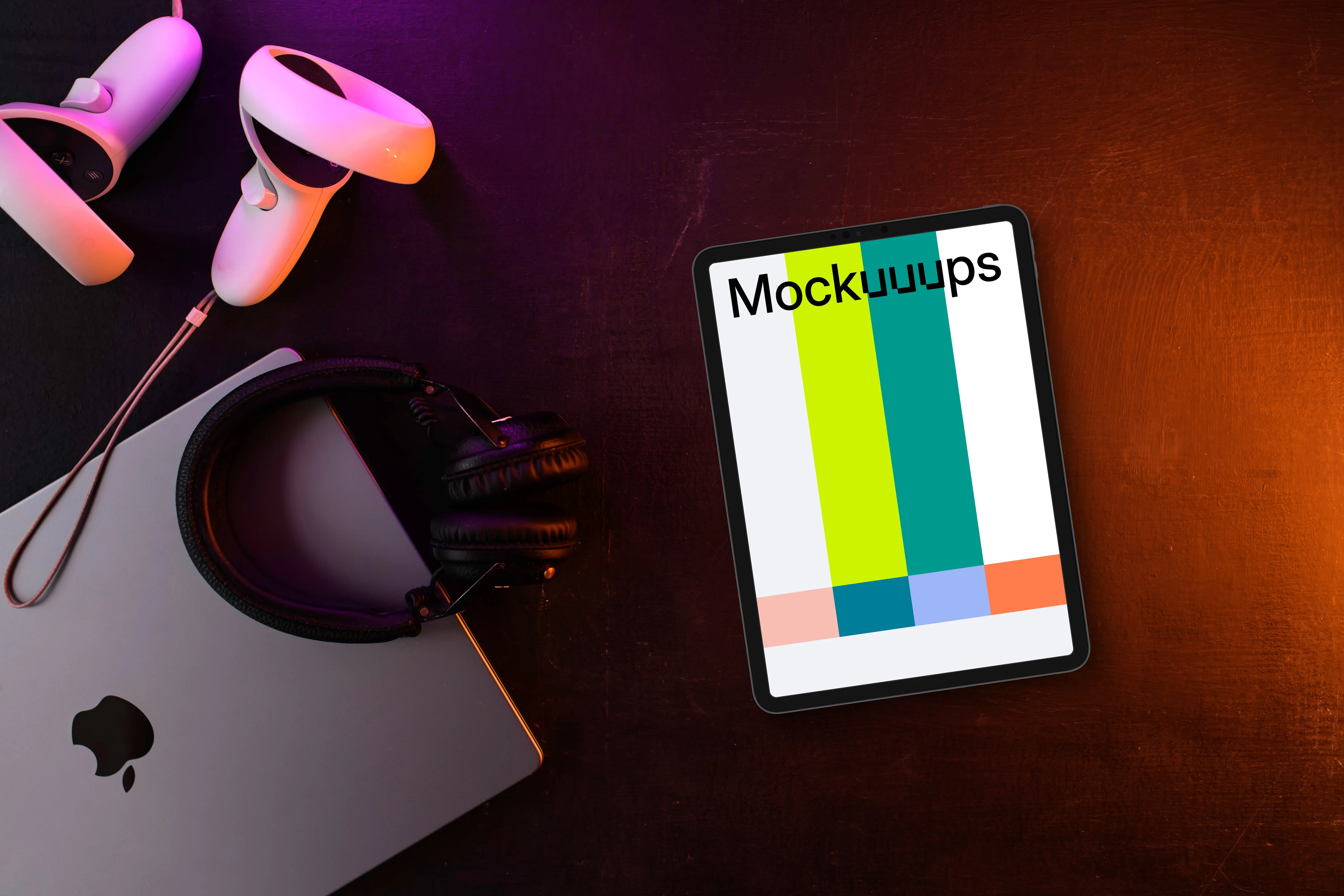 Tablet mockup with gaming gear on a dark wooden surface