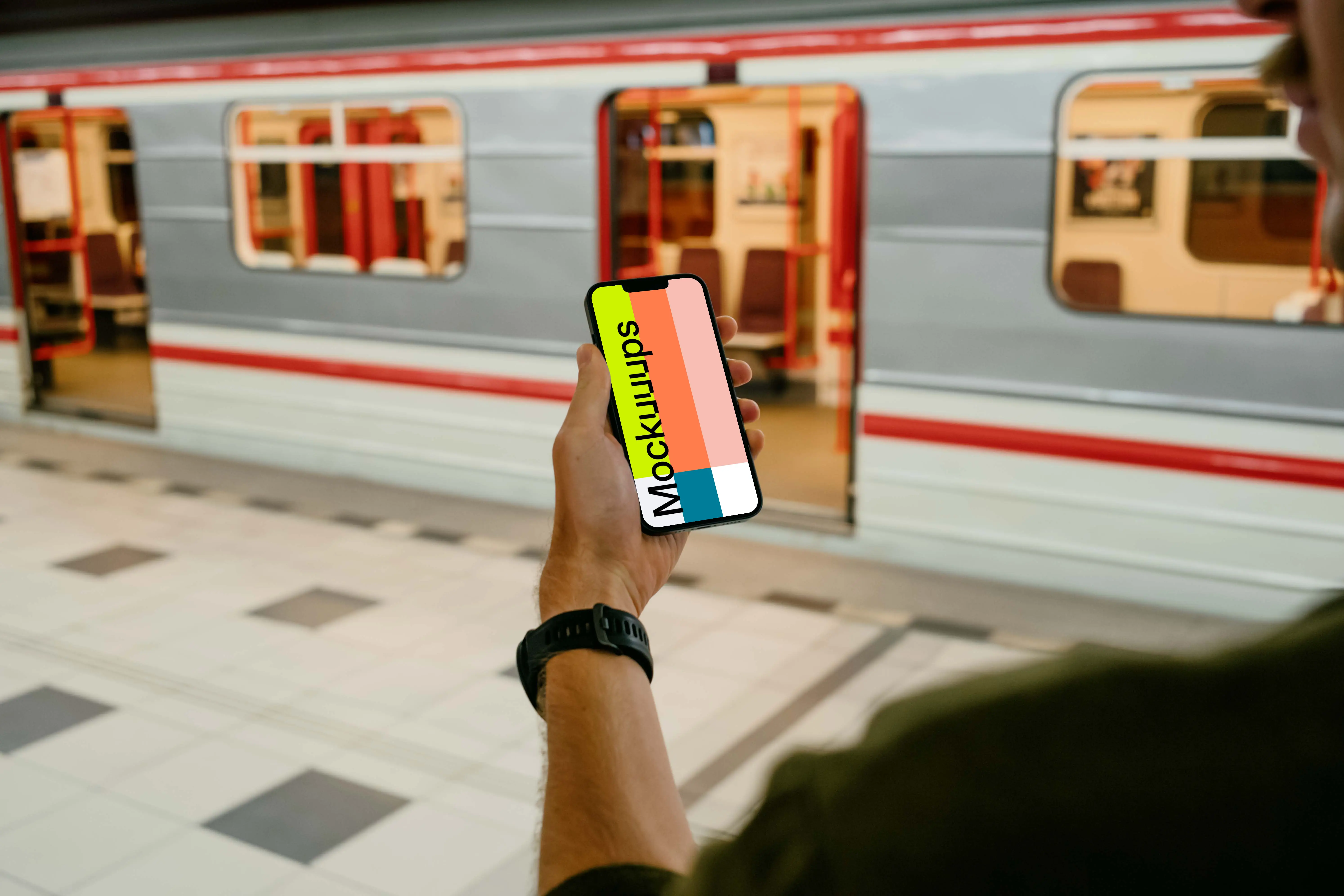 User holding an iPhone 13 mockup