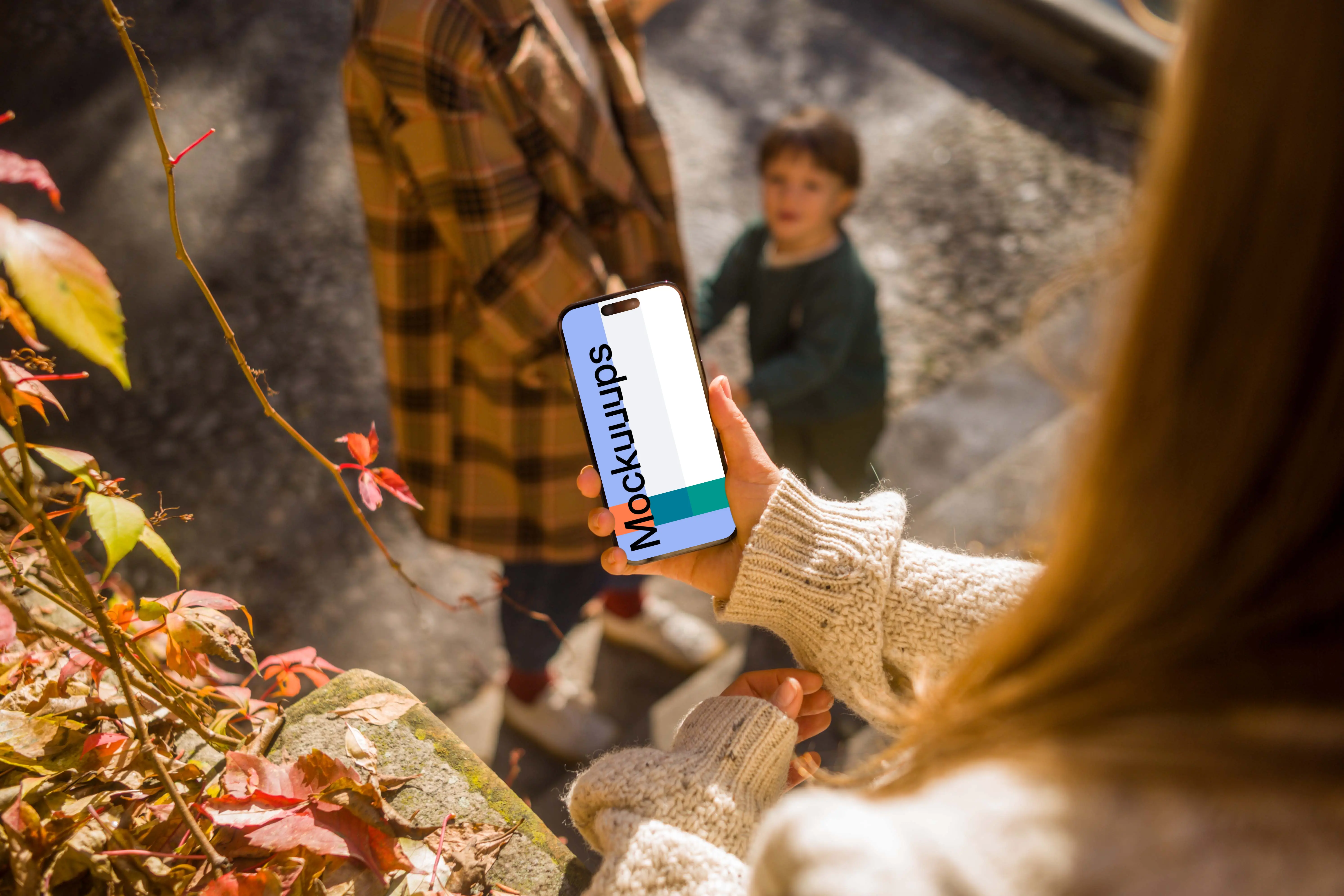 Woman hand holding an iPhone 14 Pro mockup