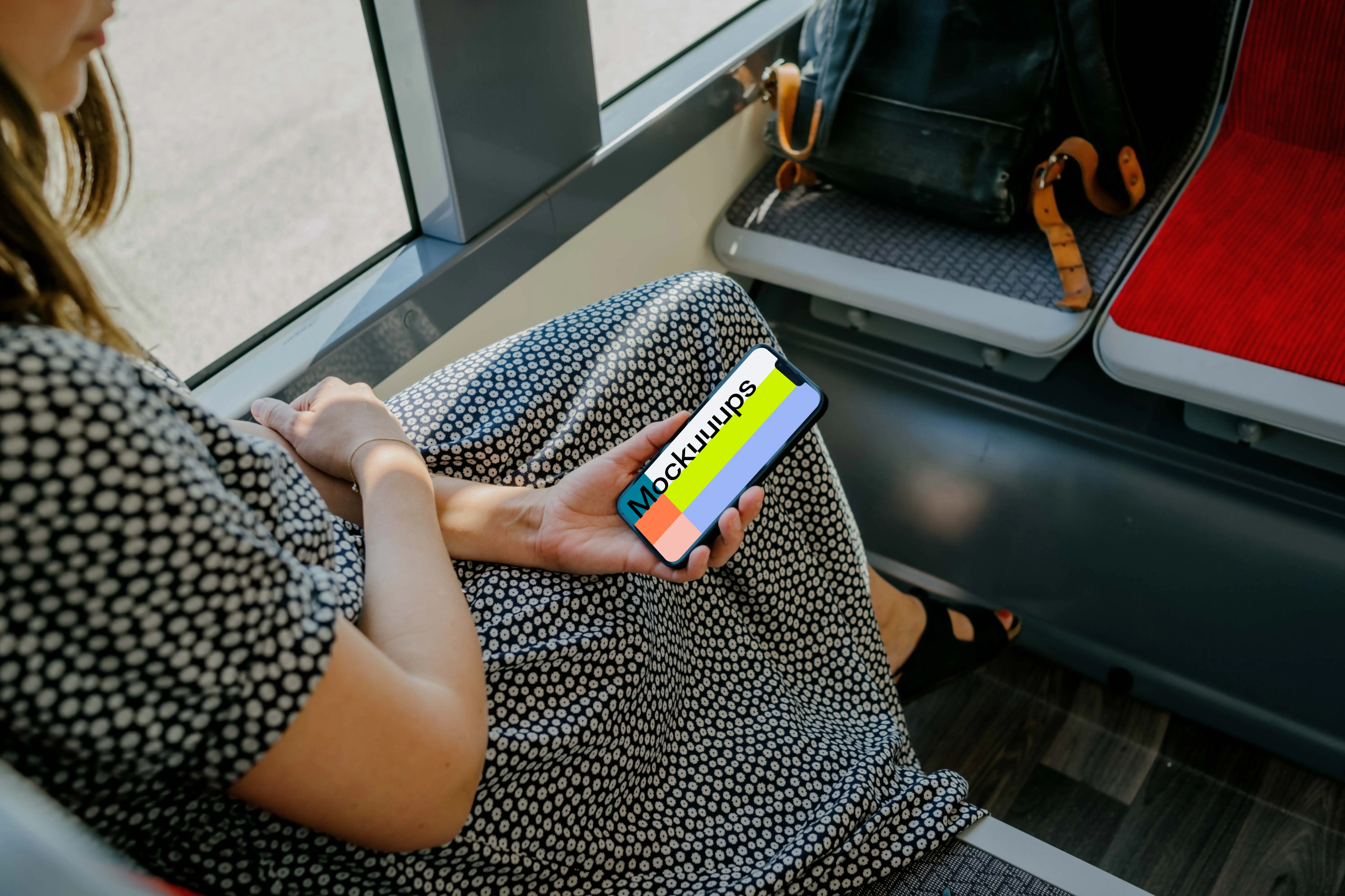 Woman hand holding an iPhone mockup