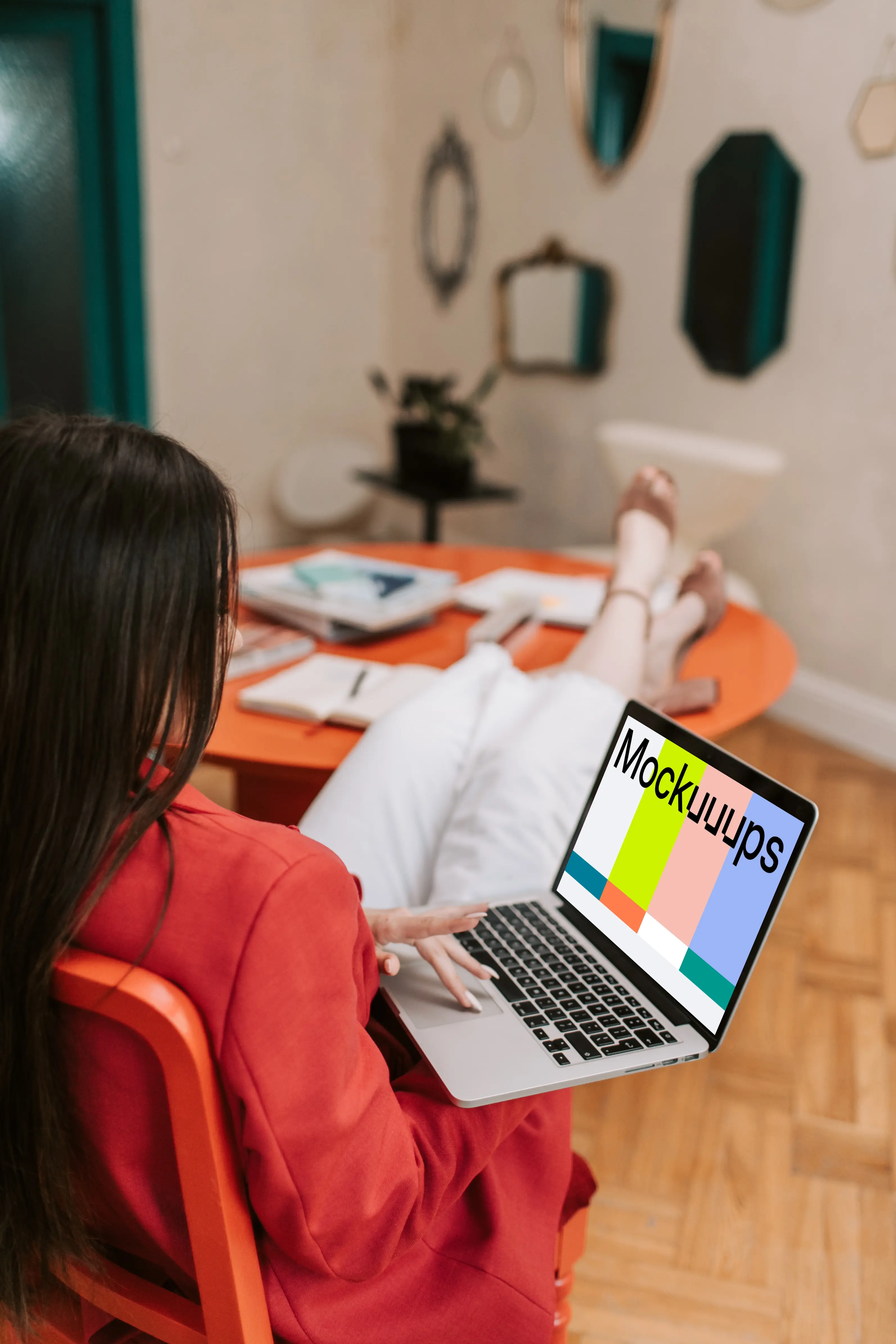 Woman holding a MacBook Pro mockup