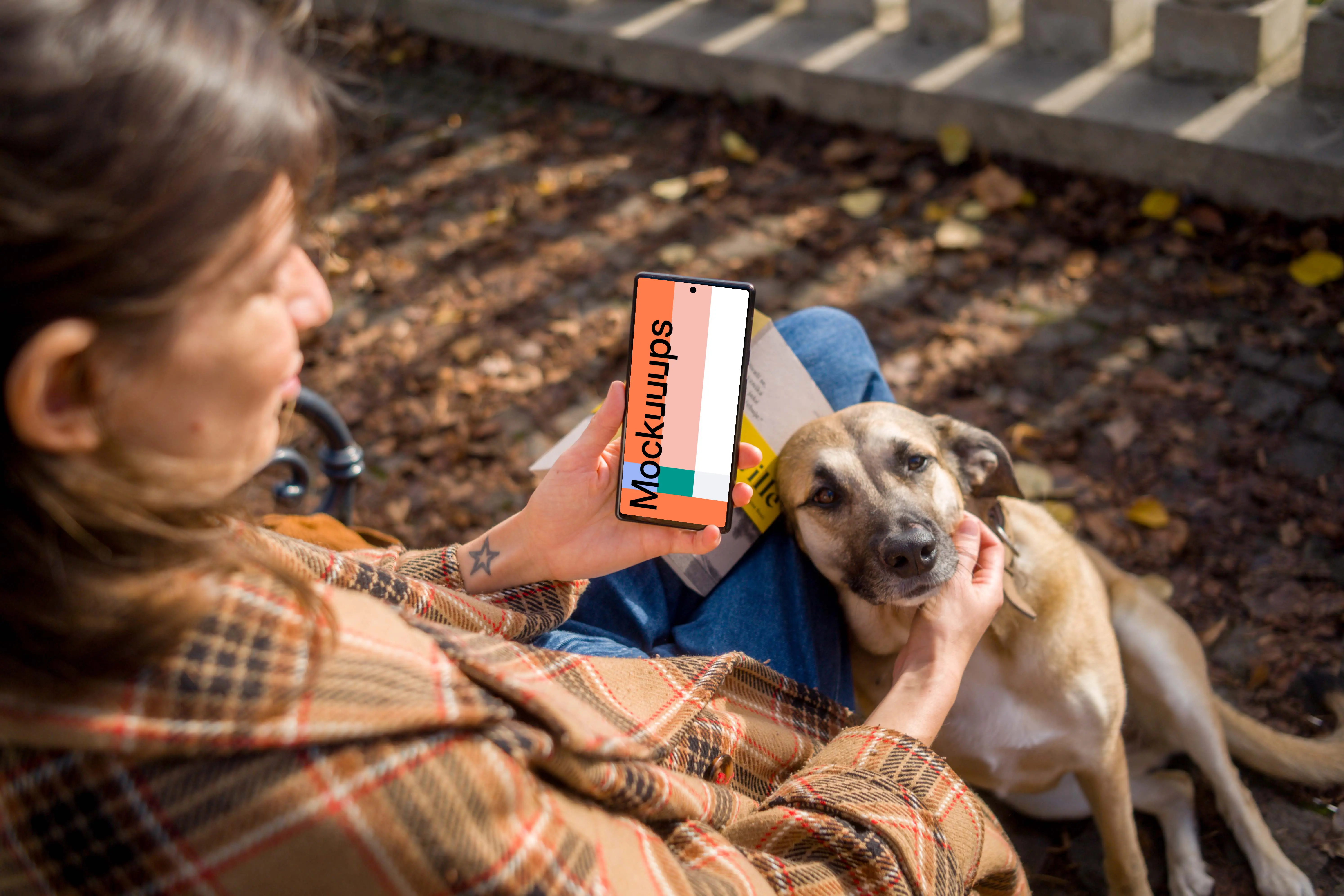 Woman holding a phone while scratching the dog mockup