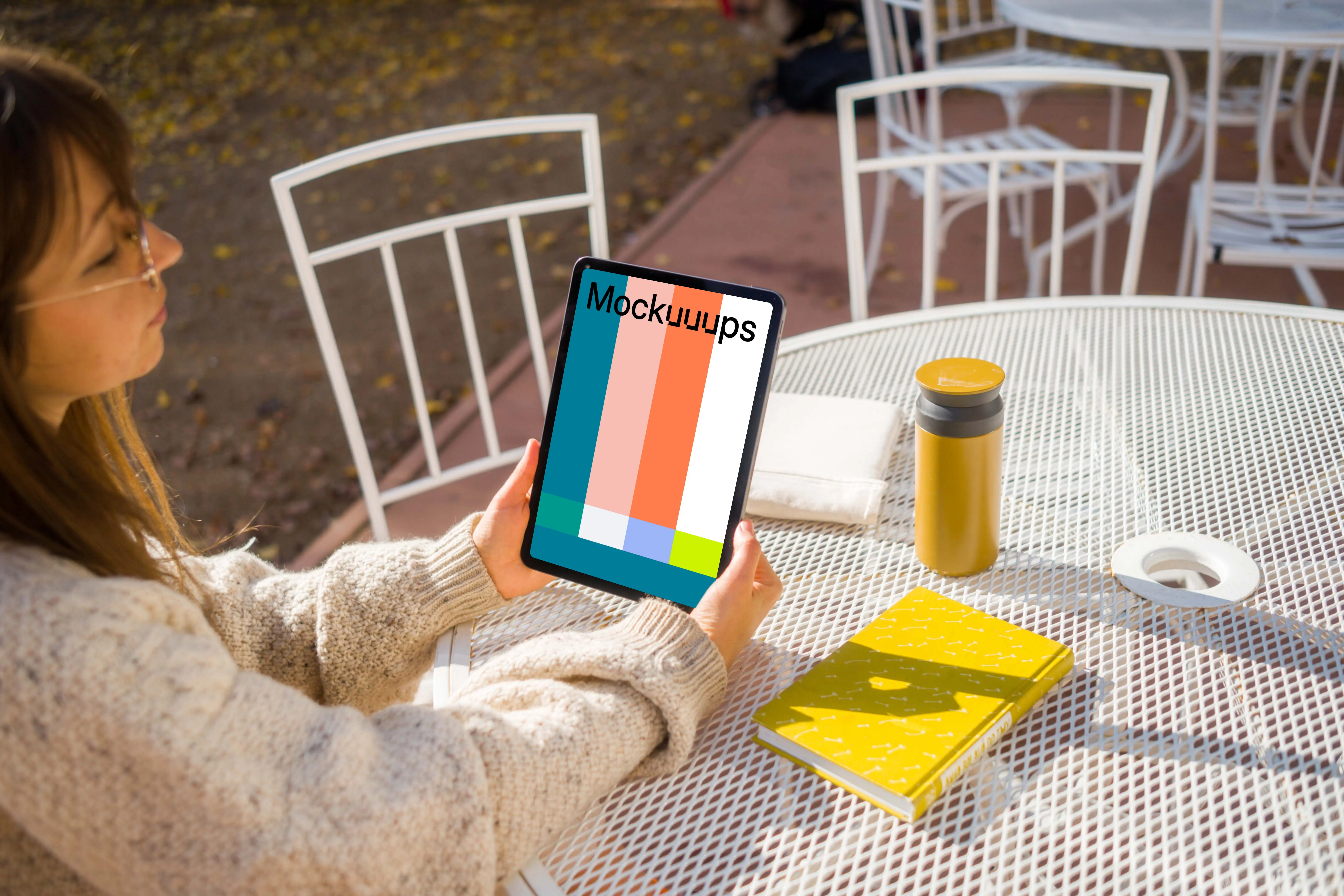 Woman holding an iPad mockup