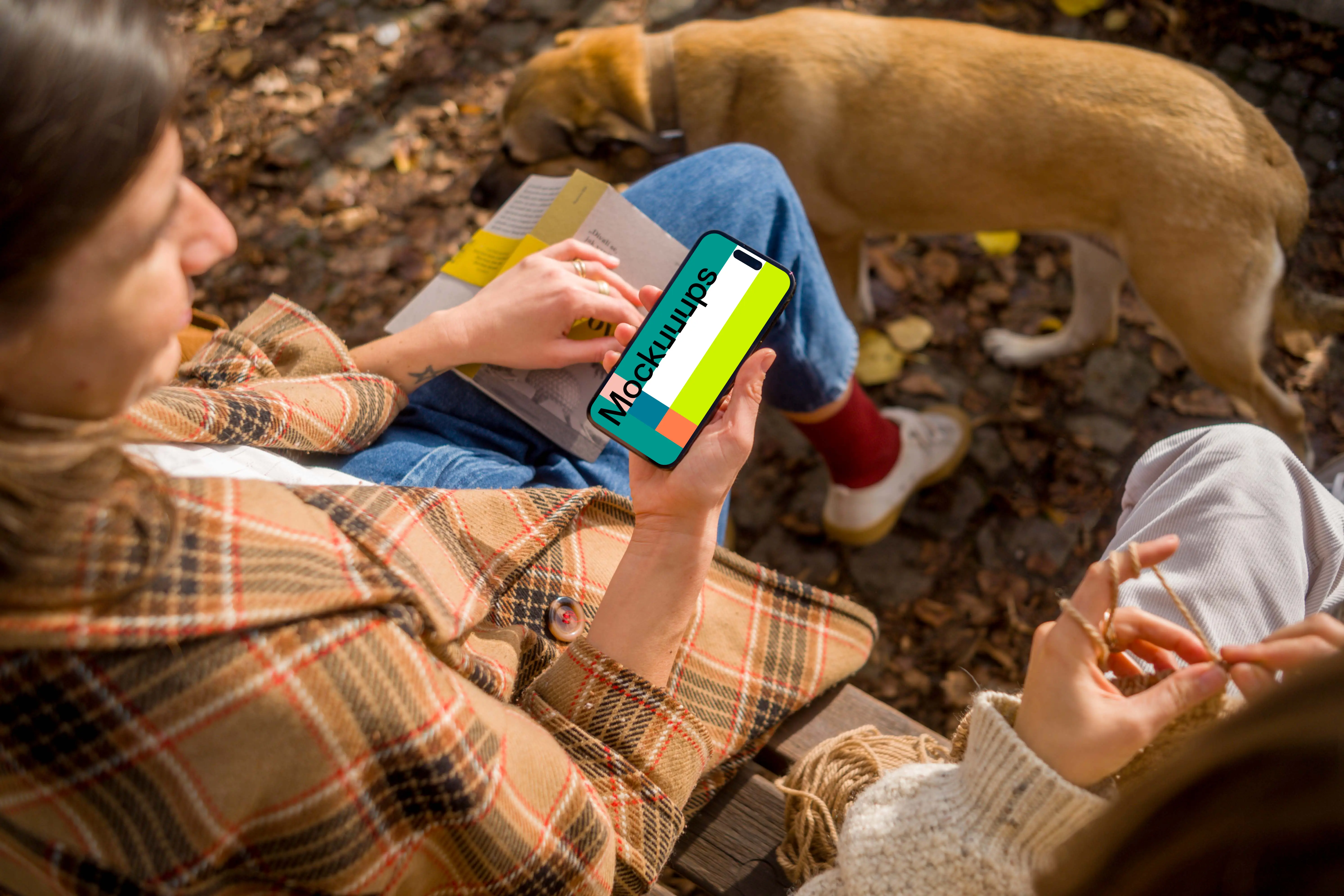 Woman holding an iPhone 14 near dog mockup