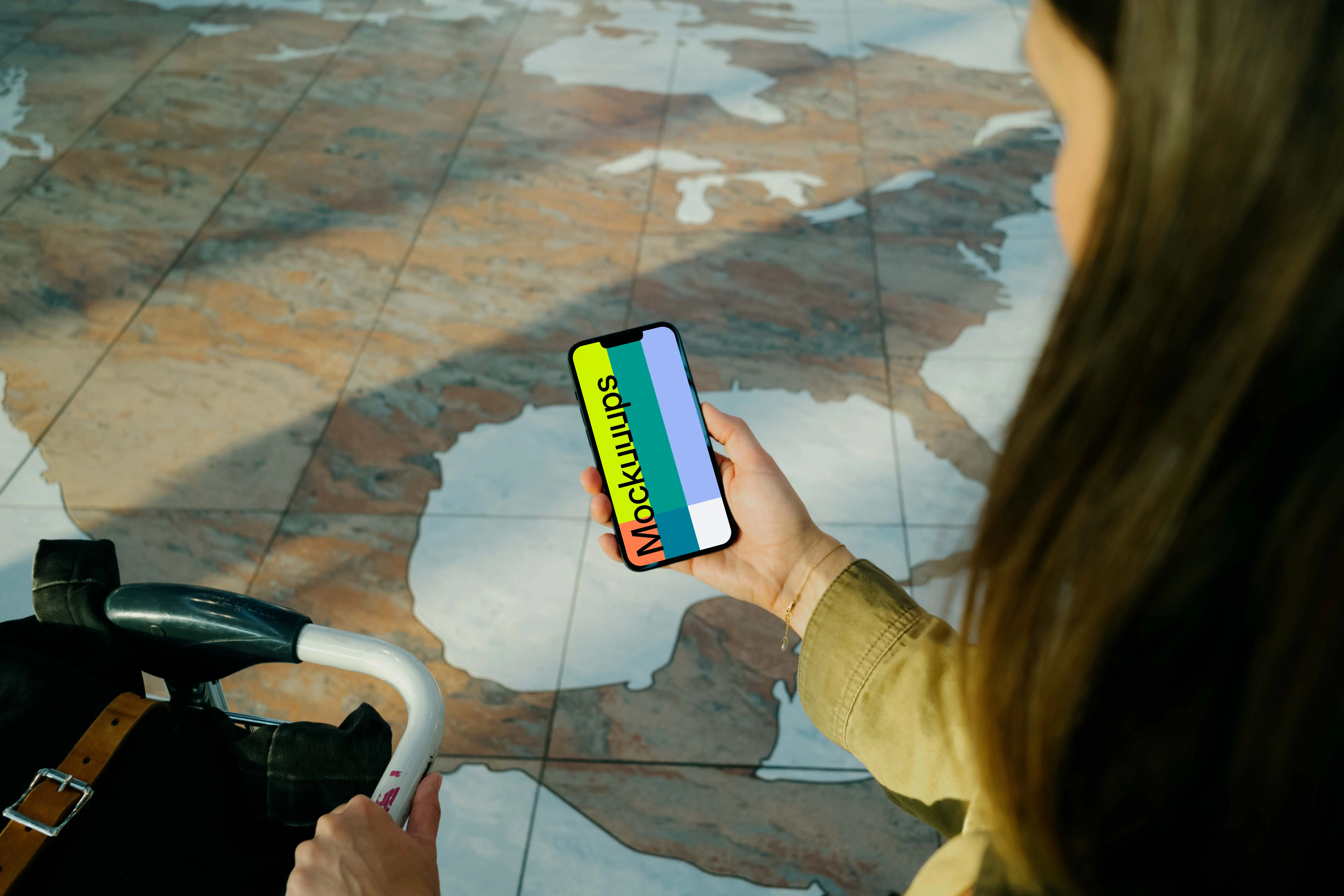 Woman holding iPhone 13 mockup at the airport