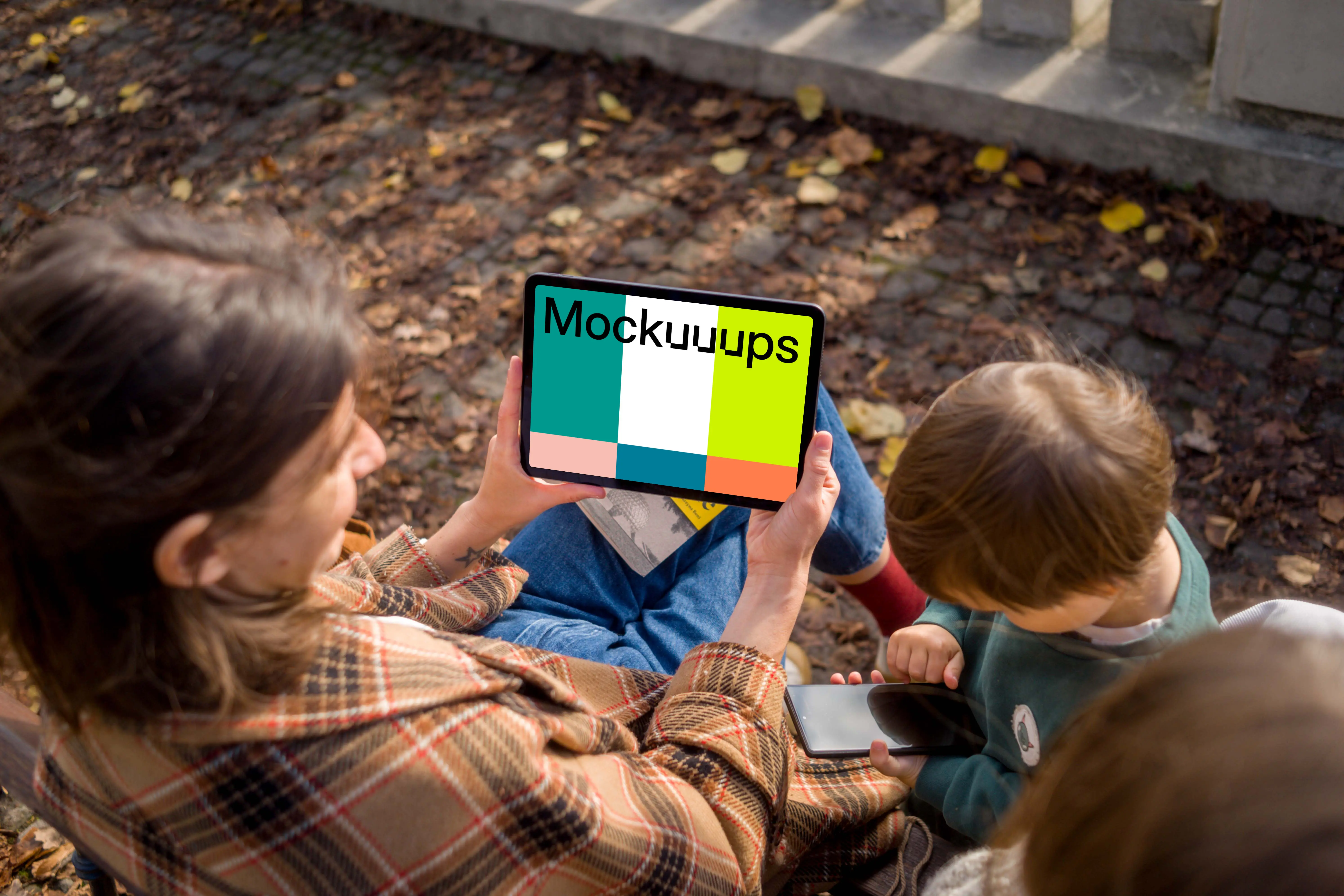 Woman near kids holding an iPad Air mockup
