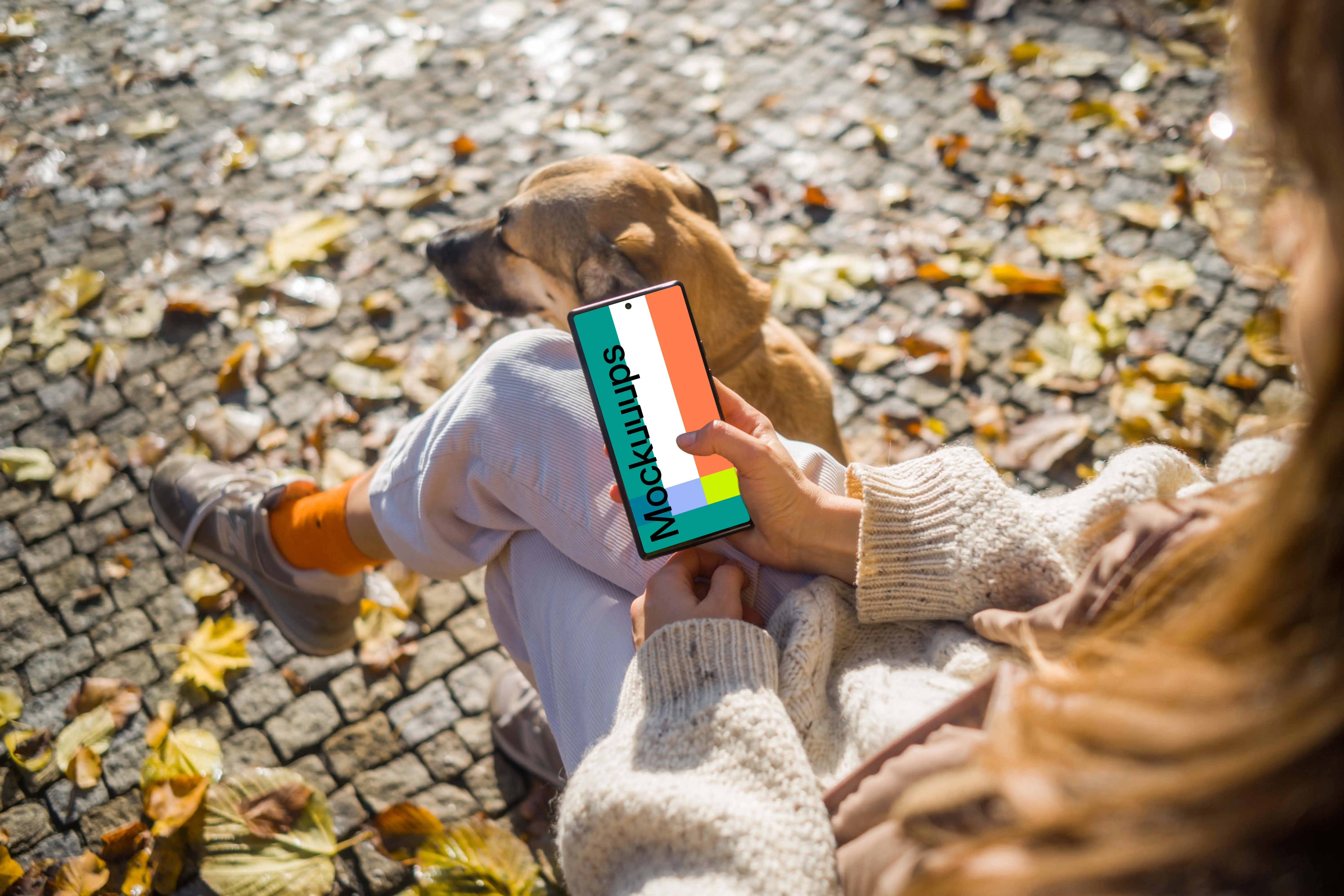 Woman scrolling on a Google Pixel 6 sitting next to dog mockup