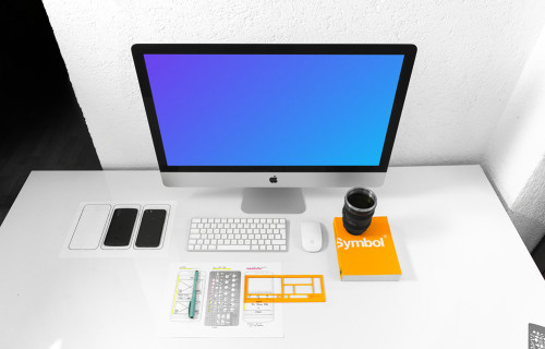 Front view of iMac mockup on white working desk