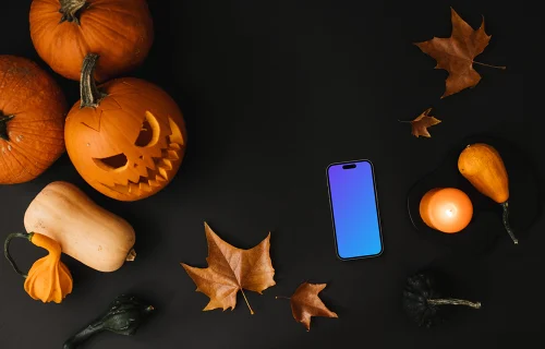 Halloween pumpkin mockup with a phone on the dark background