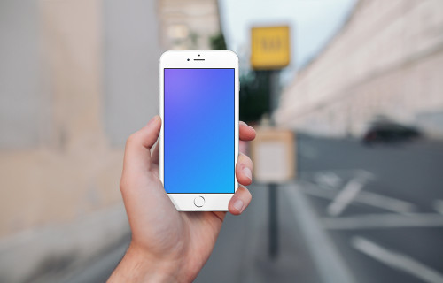 Holding iPhone 6s mockup in front of a Taxi Stand