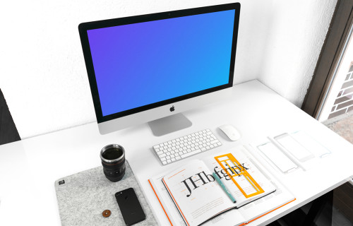 iMac mockup on white working desk