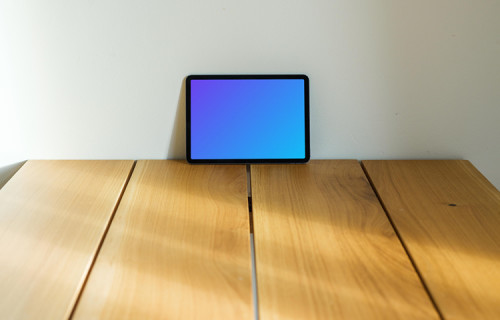 iPad Air mockup in landscape mode leaning on a wall