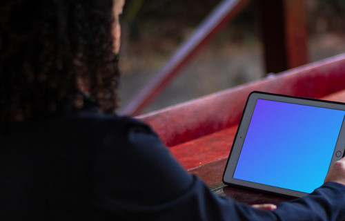 iPad Mini mockup held by female user