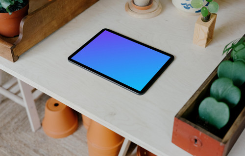iPad mockup placed flat on a white table