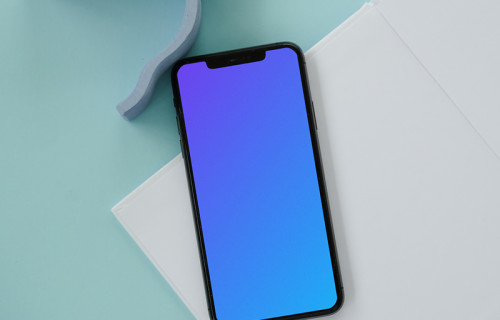iPhone mockup on a white notepad