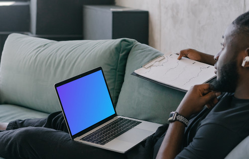 MacBook Air mockup in use by a man wearing Airpods