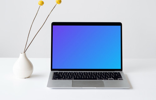 MacBook mockup on a white table