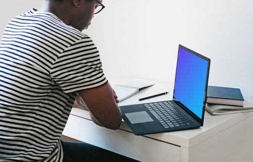 Man with Microsoft Surface Laptop mockup