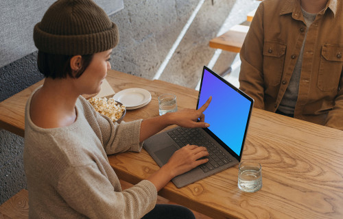Microsoft Surface Laptop mockup table on a wooden table