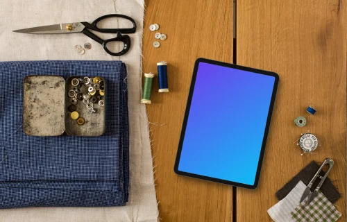 Mockup of tablet with sewing accessories