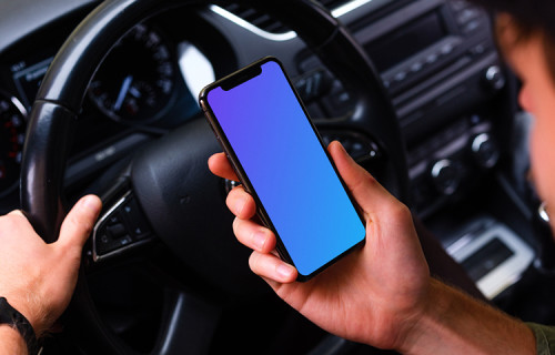 Over the shoulder view of a driver using iPhone 11 mockup