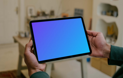 Person holding a tablet mockup
