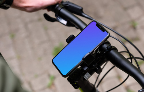 Side view of riding a bike with iPhone 11 Pro mockup in bike mount