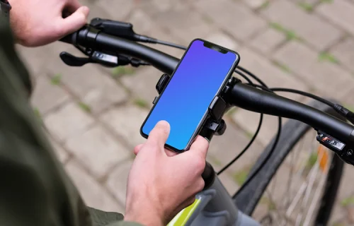 Sitting on bike tapping the iPhone 11 Pro mockup in bike mount