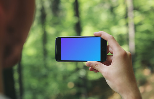 Taking a picture of forest with iPhone 6 mockup