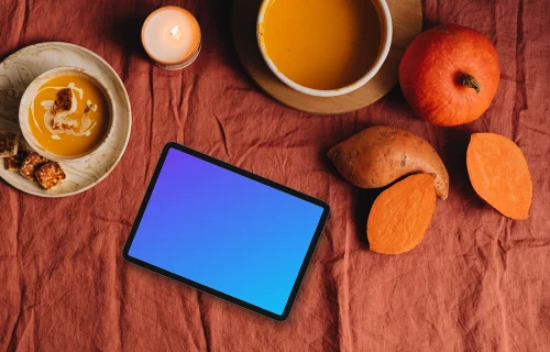 Top view of landscape tablet mockup next to pumpkins
