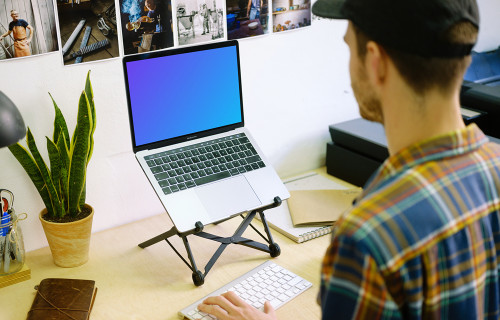 Typing on Macbook Pro mockup with desk stand