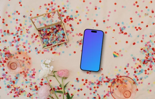 Confetti and wedding rings around iPhone mockup