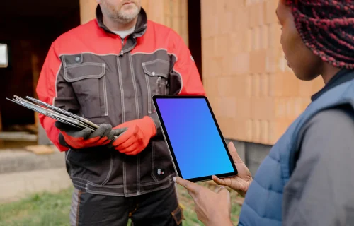 Female architect holding an iPad mockup