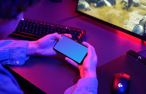 Gaming smartphone mockup in a gamer setup