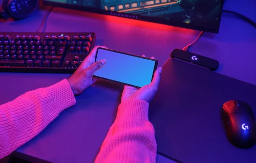 Google Pixel 6 Mockup in a Gamer's Hand with Neon Lights