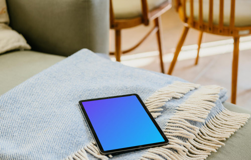 iPad Air mockup lying on a folded blanket 