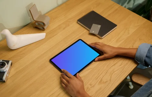 iPad Air mockup on wooden table with decorations