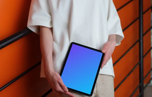 iPad Air Mockup with Woman Against Orange Wall