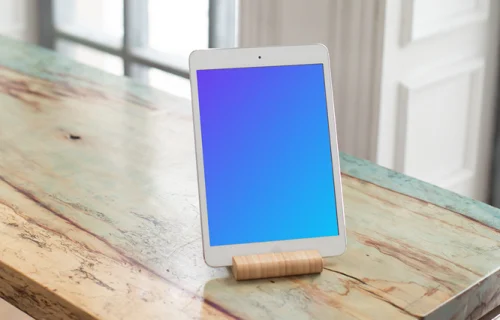 iPad Mini mockup on brightly colored wooden table