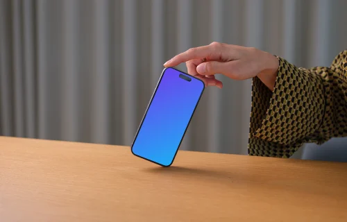 iPhone 15 Pro mockup in a woman's hand against office background