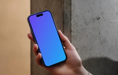 iPhone 16 mockup held against a concrete wall