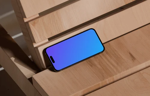 iPhone 16 mockup on wooden bench