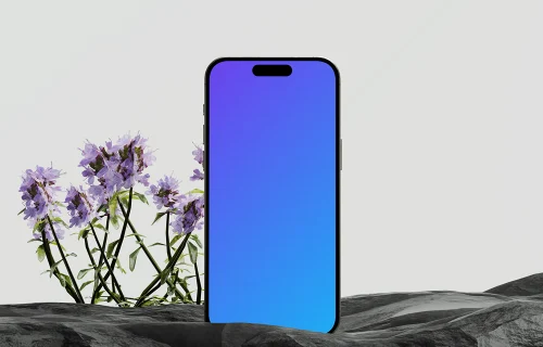 iPhone 16 mockup with floral and stone elements