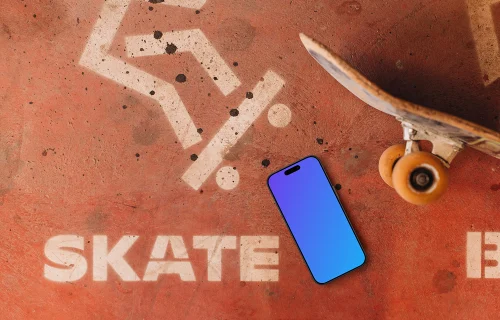 iPhone mockup next to the skateboard