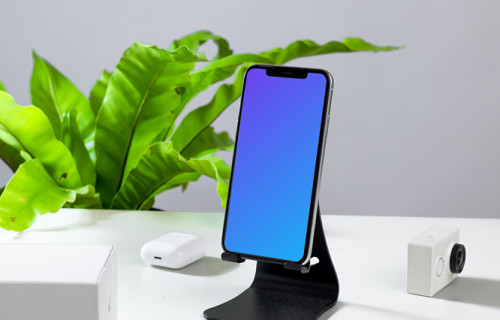 iPhone mockup en un soporte de teléfono