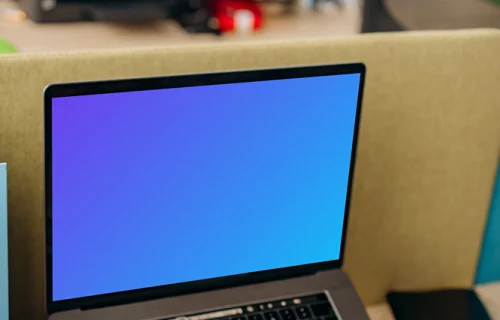 MacBook Air mockup and calculator in use by a man